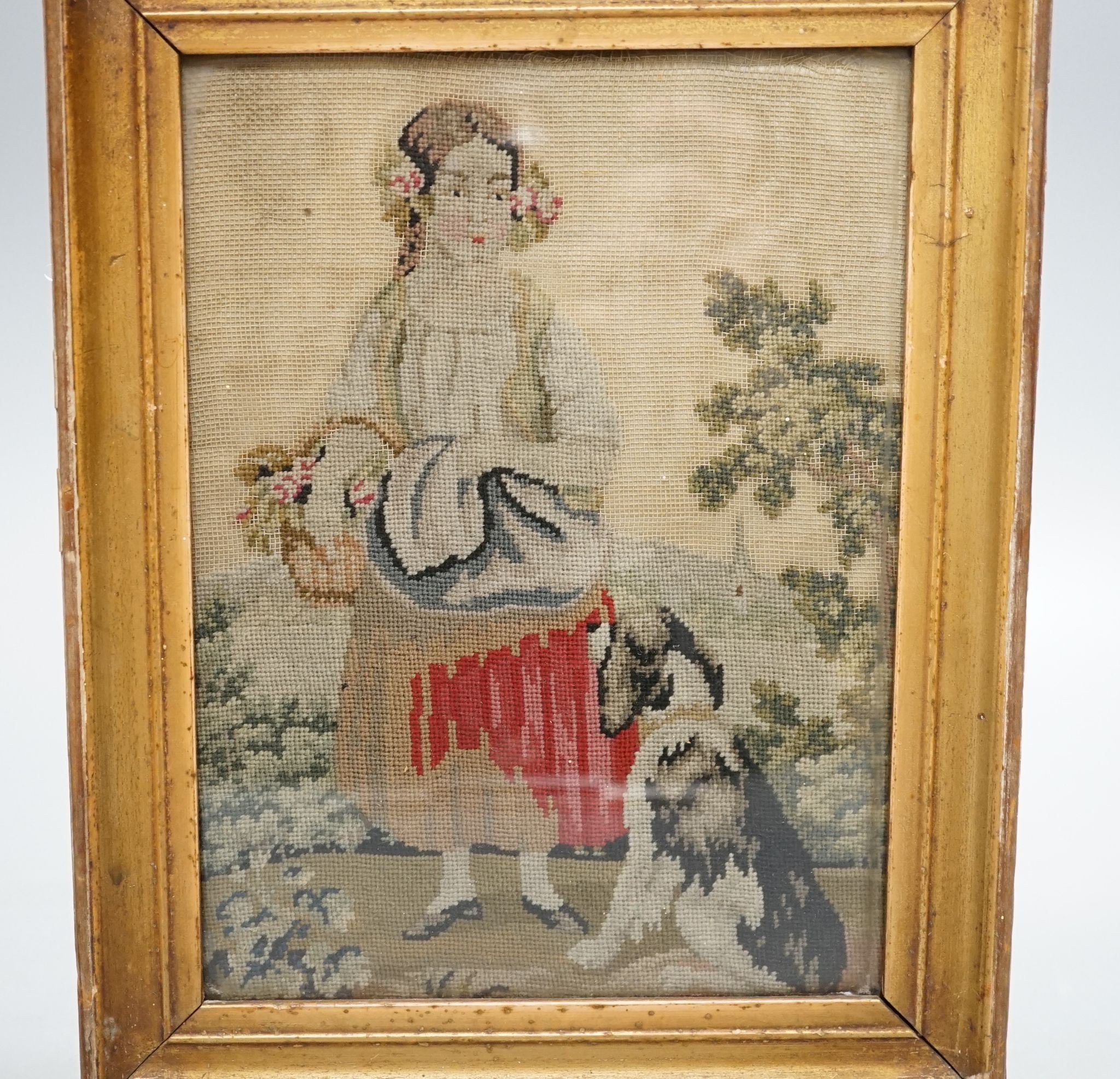 A framed Victorian petit point depicting a girl and dog, 19.5x14cm excl frame